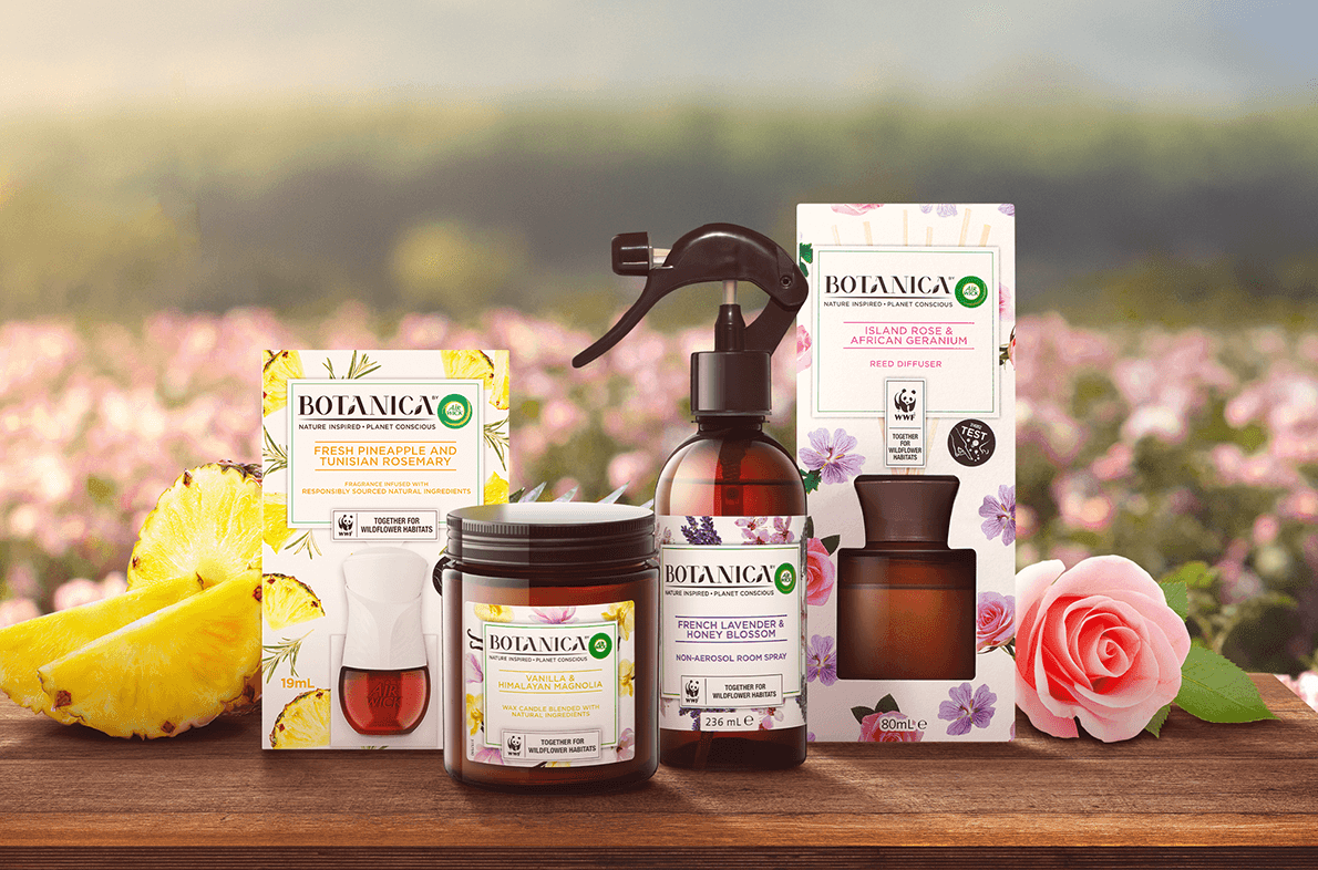 Landscape shot of flower meadow with Botanica products in the centre
